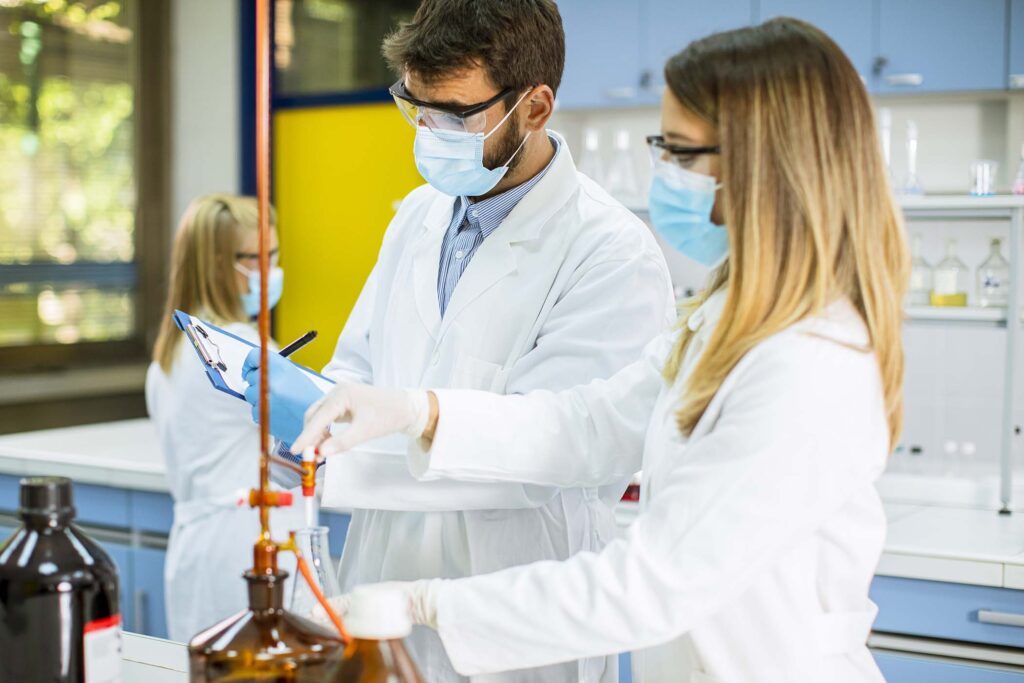 group-of-young-researchers-analyzing-chemical-data-ATH4WS6.jpg
